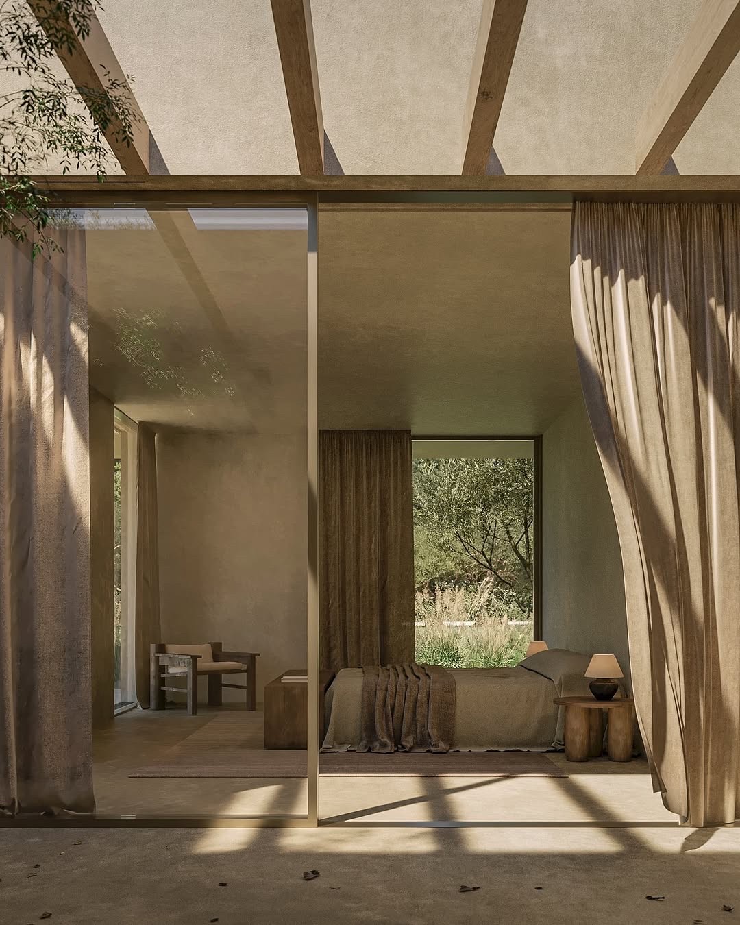 Dormitorio de tonos naturales abierto hacia el jardín.